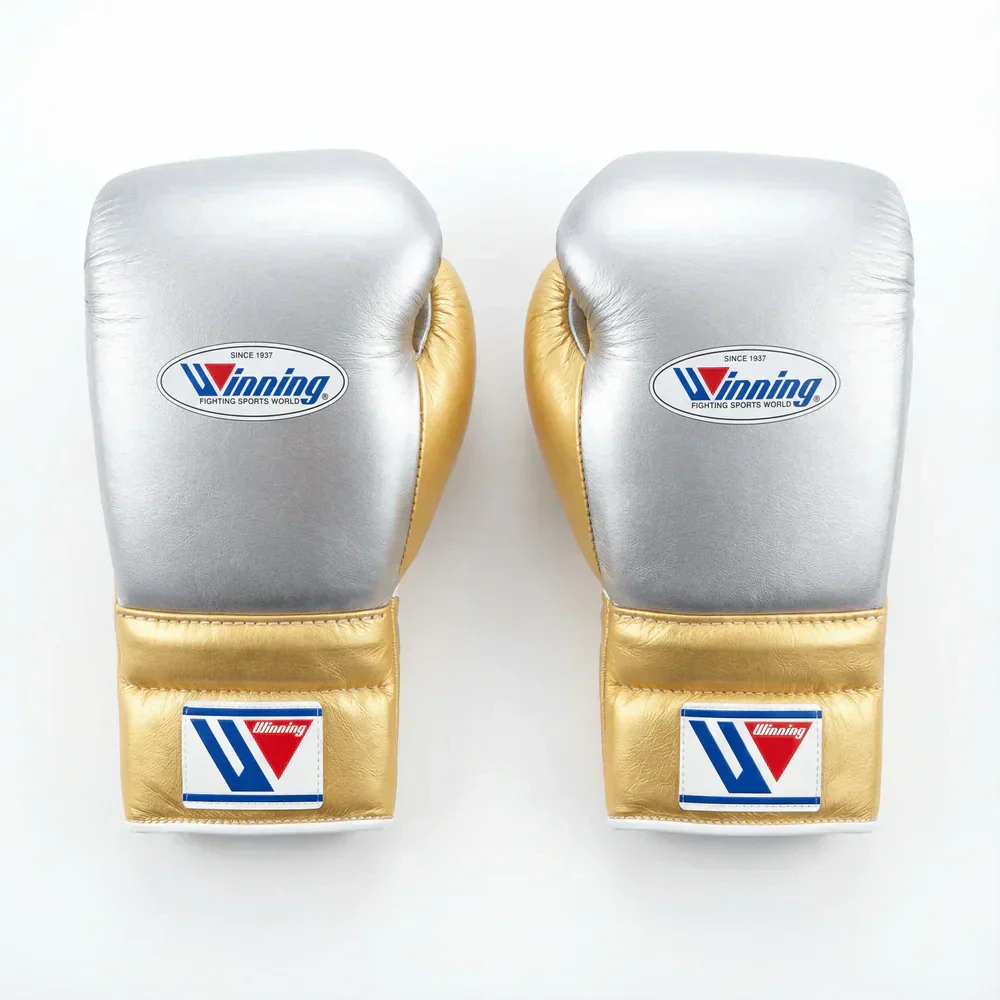 Havoc Winning Sets Boxing Collection: Premium metallic silver and gold leather professional training gloves. Features hook-and-loop wrist straps, a stitched authentic brand logo badge, and high-density foam padding. Shop elite sparring gear sets.