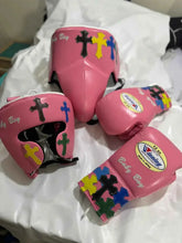 Winning MS-400 Custom Sparring Set in pink leather featuring multi-color cross patches on the gloves, headgear, and protector.