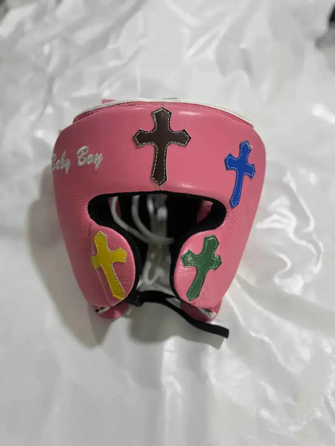 Custom Pink Winning FG-2900 professional face guard headgear handcrafted in Japan featuring multi-color cross patches.