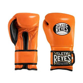 Official Cleto Reyes professional hook-and-loop training boxing gloves in vibrant orange leather featuring a black inner thumb panel, black trim leather piping, and traditional brand patches.