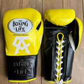 No Boxing No Life professional lace-up boxing gloves in yellow and black leather featuring the official brand patch and Canelo Alvarez CA logo.