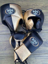No Boxing No Life custom professional sparring set in metallic gold and black split-leather including lace-up gloves, headgear, and groin protector.