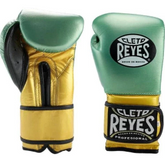 Official Cleto Reyes professional hook-and-loop training boxing gloves in a metallic green leather face paired with metallic gold leather palms, a matching gold wrist strap, and black contrast borders.