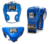 Official Cleto Reyes professional 3-piece boxing sparring gear set featuring matching lace-up gloves, a cheek protector headguard, and a groinguard in uniform royal blue leather.