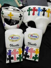 Custom White Winning MS-600 professional lace-up boxing gloves handcrafted in Japan featuring multi-colored cross patches on the cuffs.