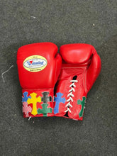 Custom Red Winning MS-300 professional lace-up boxing gloves handcrafted in Japan featuring multi-colored cross patches on the cuffs.