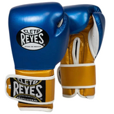 Official Cleto Reyes professional hook-and-loop training boxing gloves in metallic blue leather featuring brilliant metallic gold leather thumbs, palms, and cuffs with clean white leather piping.