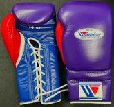 Custom Winning professional 14oz lace-up boxing gloves featuring a royal purple leather face, a vibrant blue palm with a white lace channel, and a bold red leather thumb block.