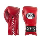 Official Cleto Reyes professional lace-up training boxing gloves in red leather featuring white laces, high-contrast white stitching, and traditional black brand markings.
