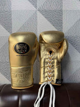 No Boxing No Life professional lace-up boxing gloves in full metallic gold leather featuring the official brand patch and contrasting white laces.