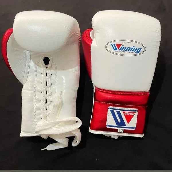 Winning professional custom 3-piece boxing sparring gear set featuring a matching lace-up glove pair, full-face headguard, and groinguard in an asymmetrical half metallic red and half white split leather colorway.