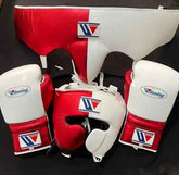 Winning professional custom 3-piece boxing sparring gear set featuring a matching lace-up glove pair, full-face headguard, and groinguard in an asymmetrical half metallic red and half white split leather colorway.