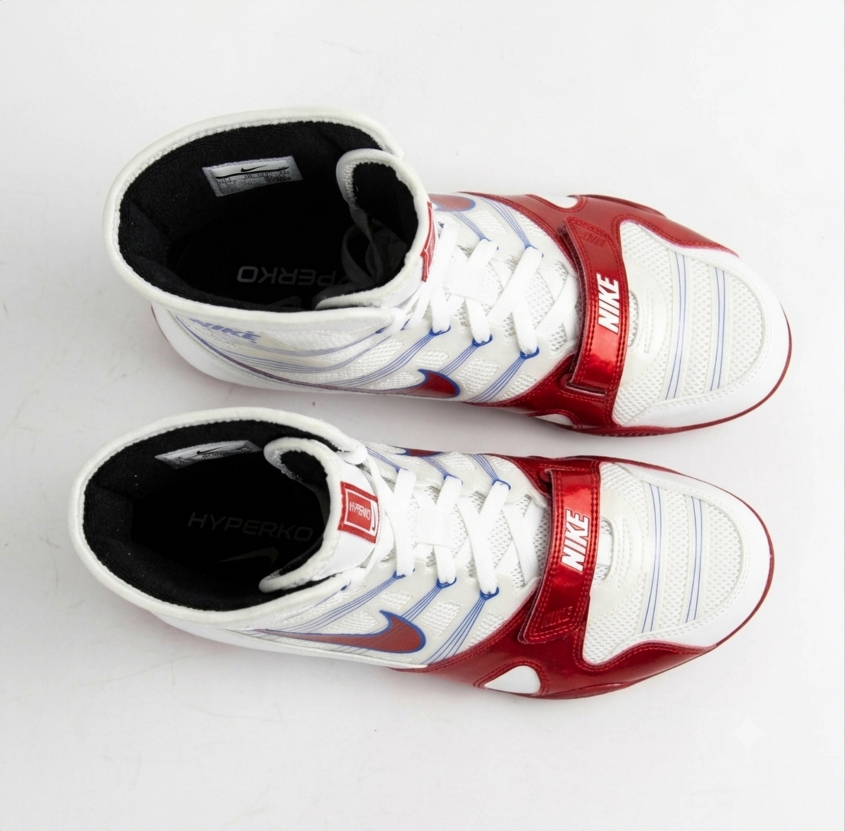 Nike Hyperko 1 boxing shoes in white, red, and blue displayed on a light gray background