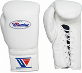 A pair of white leather boxing gloves shown on a plain white background, displaying both the front with the Winning logo and the side with the lace-up closure.