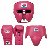 Pink boxing gear set including a headguard, boxing gloves, and a shin guard, shown on a plain white background. The Victorious brand logo is visible on the gear.