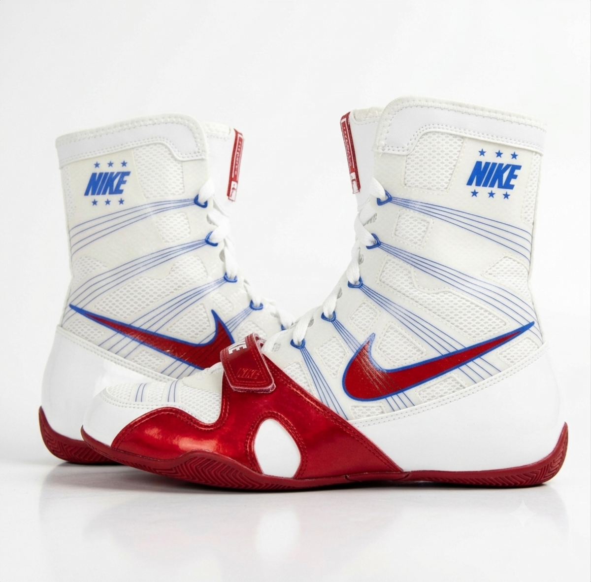 Nike Hyperko 1 high-top boxing shoe in white, red, and blue with red Swoosh and blue Nike branding on ankle collar