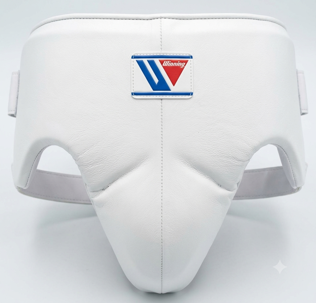 A white leather Winning brand boxing groin and kidney protector against a clean background, featuring a subtle central seam and the iconic blue and red Winning logo patch centered on top.