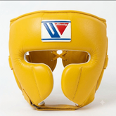 A yellow leather boxing headguard with a white, blue, and red Winning brand patch on the forehead, shown against a plain white background.