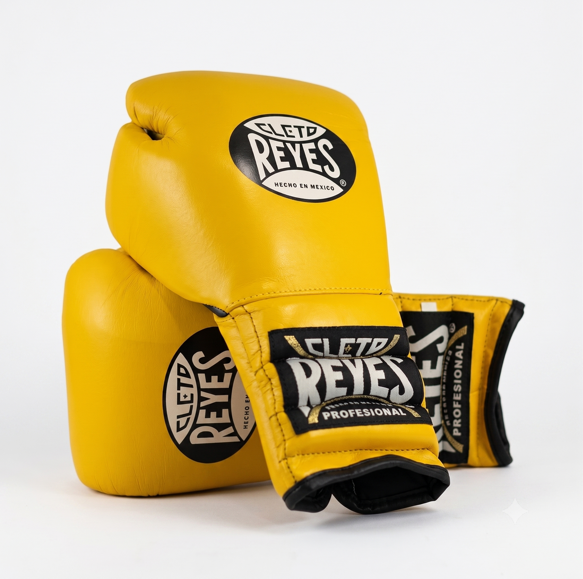 Three Cleto Reyes yellow boxing gloves stacked showing brand logo on knuckle and wrist strap