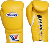 A pair of yellow leather boxing gloves shown on a white background, displaying the front logo patch and the lace-up closure on the back.