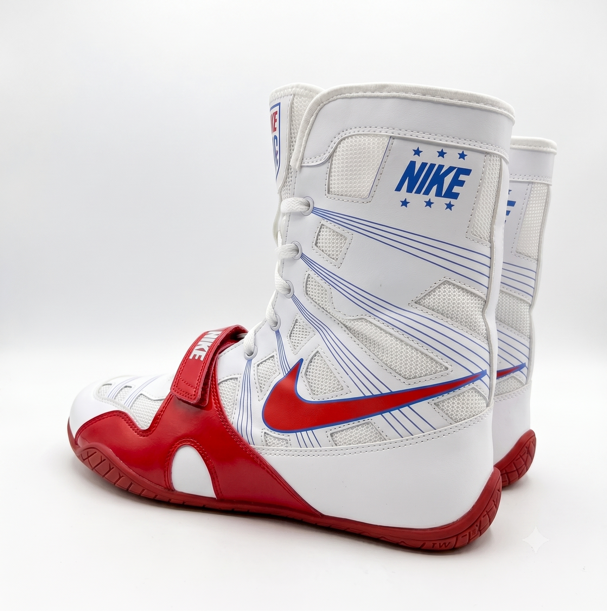 Nike Hyperko 1 white high-top boxing shoes with red and blue branding shown from a three-quarter angle