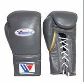 A pair of gray leather boxing gloves shown from the front and side on a plain white background. The gloves feature the Winning brand logo on the front and wrist strap, with white laces on the side view.