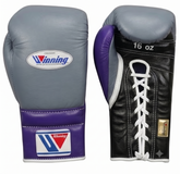 A pair of Winning brand boxing gloves shown from the front and back on a plain white background. The gloves are size 16 oz and feature a gray leather body with purple wrist wraps and heel counters, plus a black lace-up back panel with white laces.