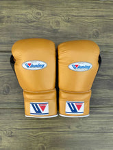 Custom Winning MS-600 professional lace-up boxing gloves in gold leather with black palms, handcrafted in Japan.