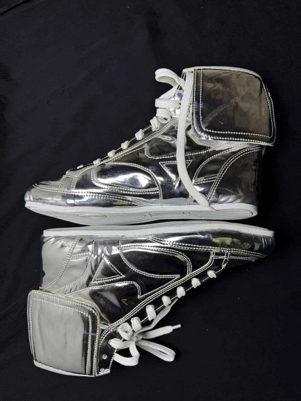 Rear view of custom metallic silver boxing boots showing heel and sole
