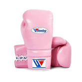 Official Winning professional lace-up training boxing gloves in premium pink leather featuring white laces, a white contrast lacing border, and the iconic brand logo crest on the cuffs.
