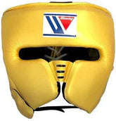 Custom Winning FG-2900 professional boxing headguard in metallic gold leather with official branding and streamlined cheek protectors.
