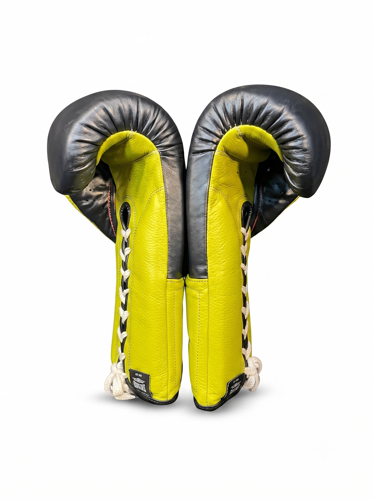 Neon yellow and black lace-up boxing gloves with white laces
