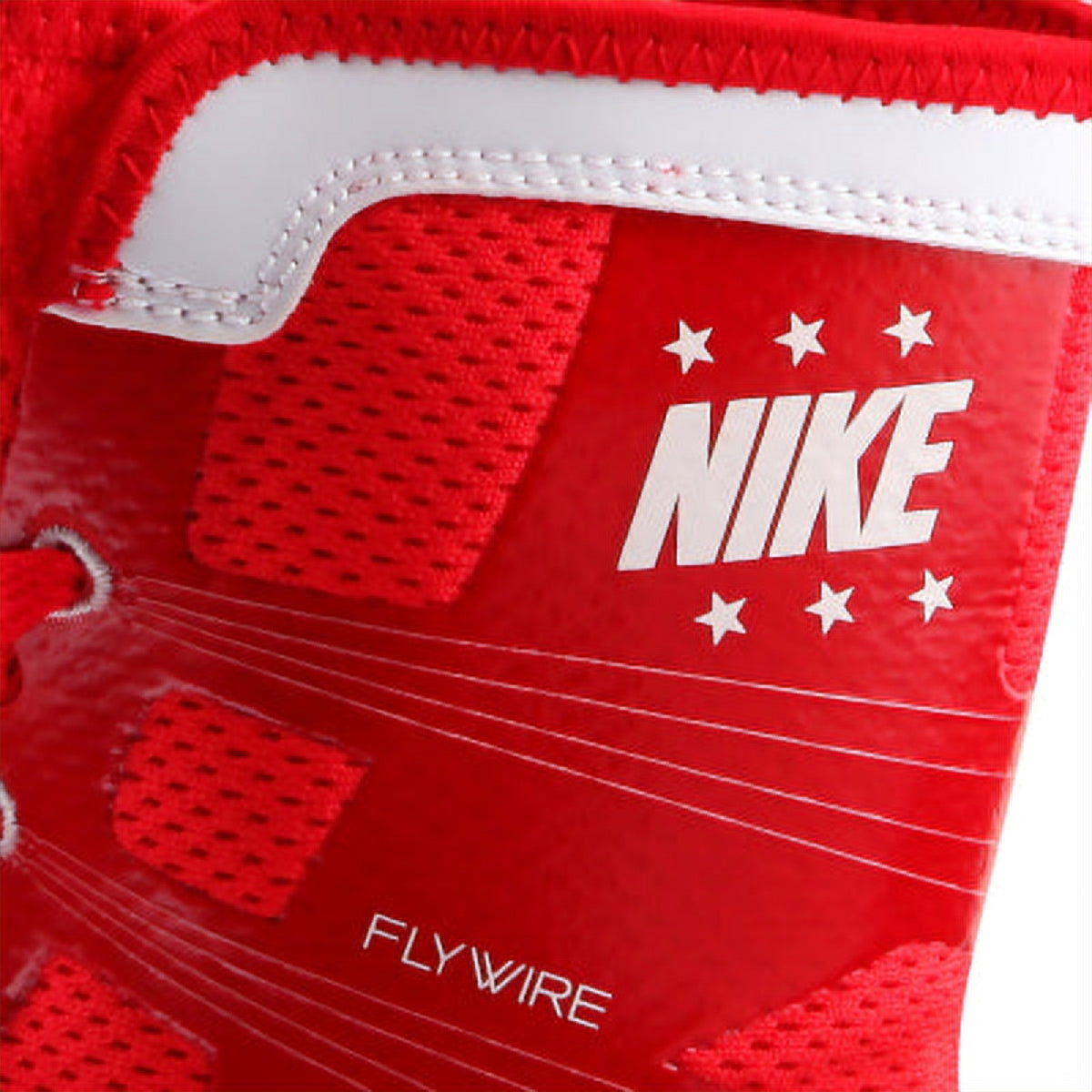 Detailed view of upper ankle collar mesh, Nike logo, and embedded red Flywire strands