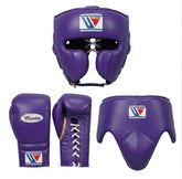 Purple boxing protective gear set including a headguard, gloves, and a chinski guard, shown on a clean white background. Each item features a white, blue, and red Winning brand logo patch.