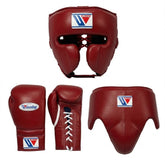 A set of boxing protective gear in dark red leather, including a boxing headguard, a pair of boxing gloves, a lace-up boxing arm guard, and a chest guard, all shown on a plain white background. The gloves and headguard feature a white, red, and blue logo patch for 'Winning'.