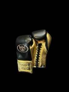 Authentic black and metallic gold No Boxing No Life professional boxing gloves handcrafted in Mexico with official branding.
