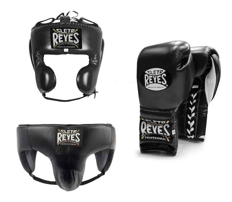 Official Cleto Reyes professional 3-piece boxing sparring gear set featuring matching lace-up gloves, a cheek protector headguard, and a groinguard in uniform classic black leather.