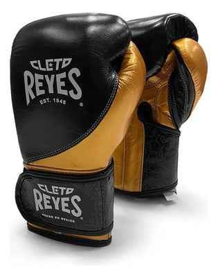 Special edition Cleto Reyes professional hook-and-loop training boxing gloves in black and gold leather featuring a printed heritage pattern on the wrist cuffs.