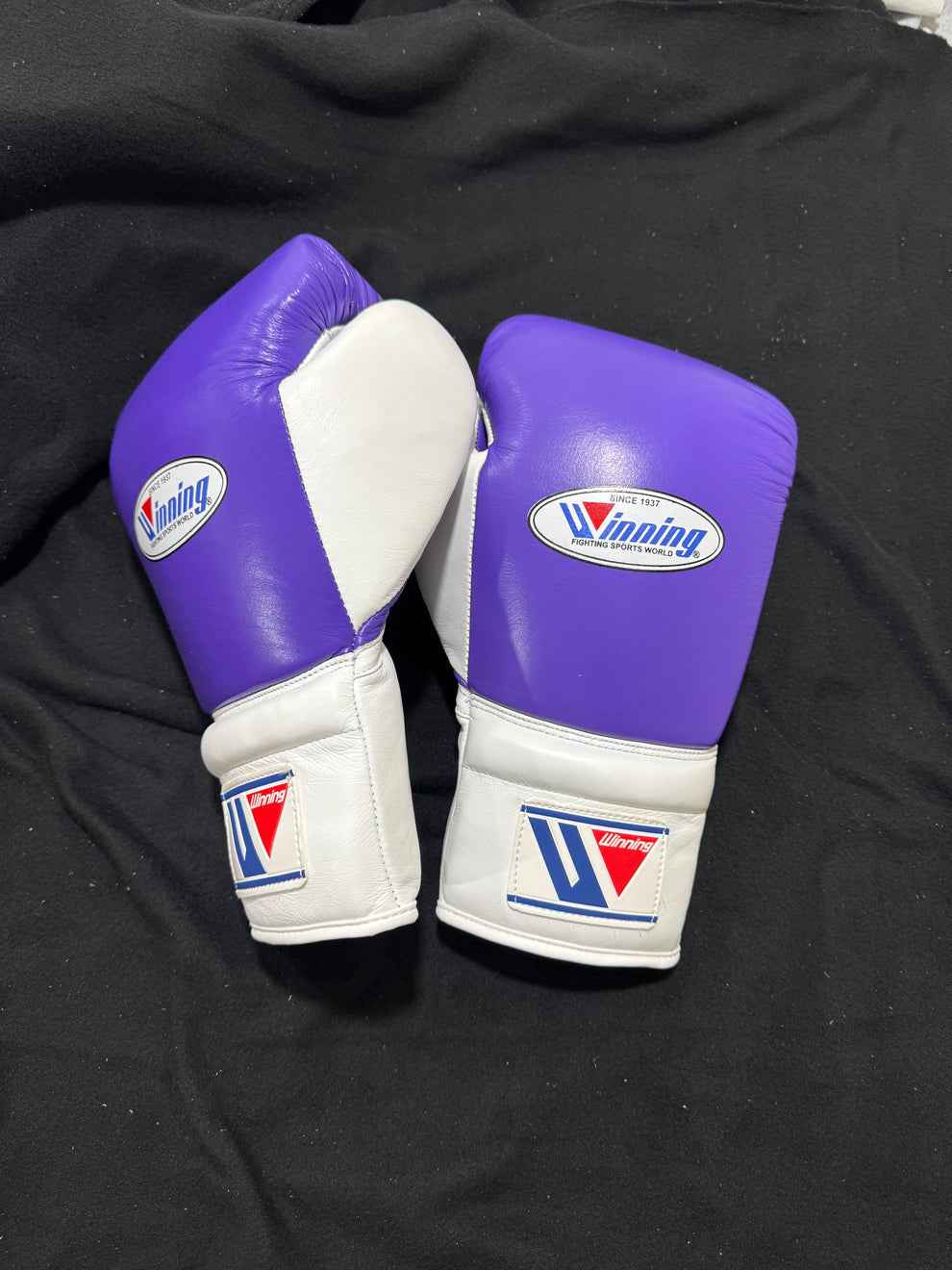Custom Winning MS-600 professional lace-up boxing gloves in purple and white leather, handcrafted in Japan.