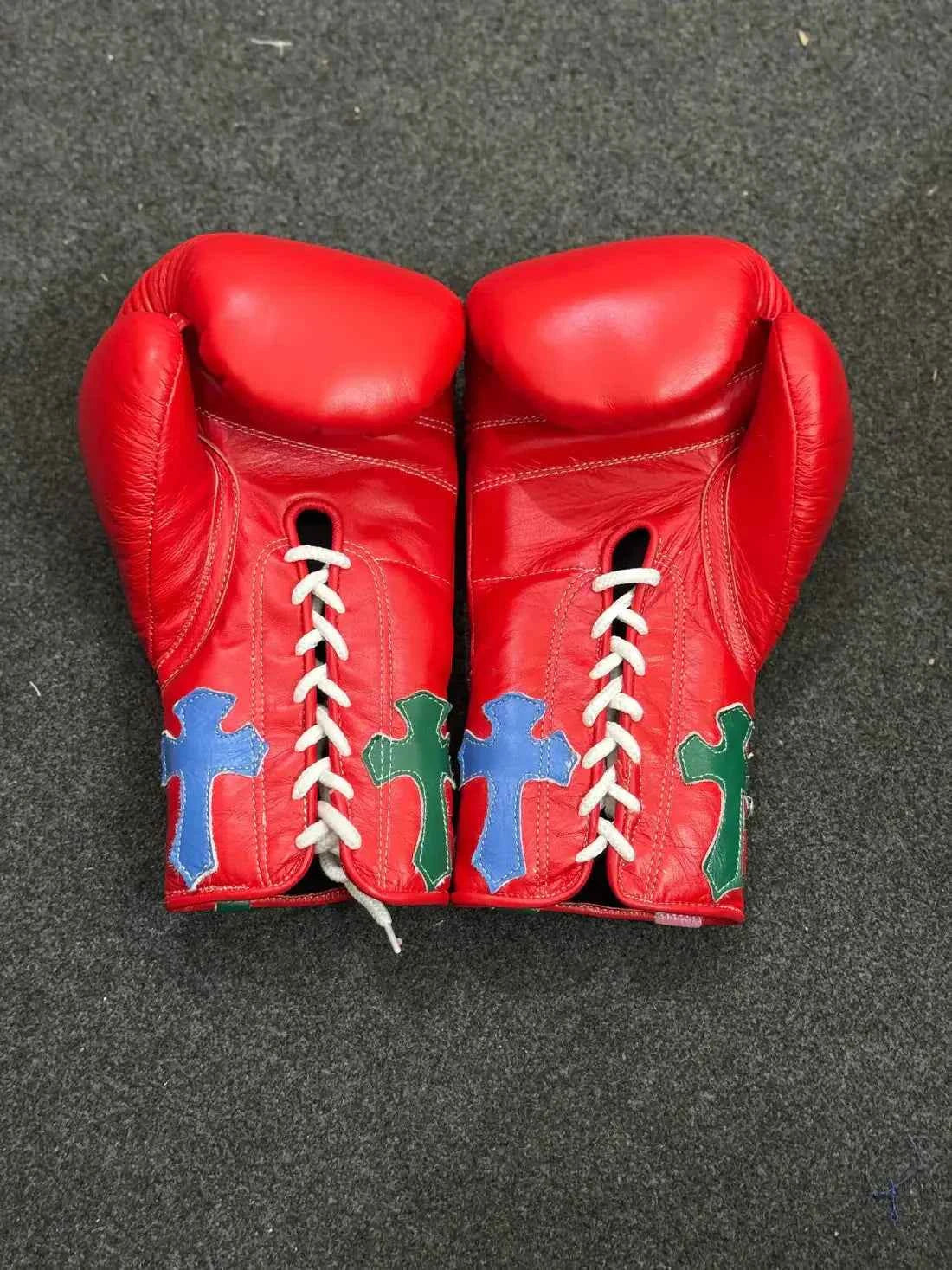 Custom Red Winning MS-300 professional lace-up boxing gloves handcrafted in Japan featuring multi-colored cross patches on the cuffs.