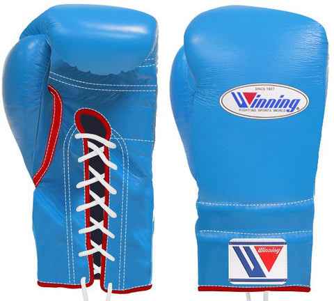 Custom Winning professional lace-up boxing gloves in sky blue leather featuring distinct red trim borders, white branding patches, and contrasting white laces.