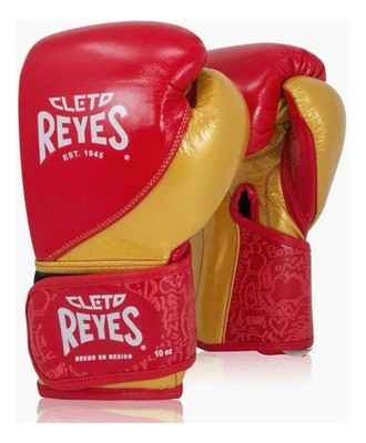 Special edition Cleto Reyes professional hook-and-loop training boxing gloves in red and gold leather featuring a printed heritage pattern on the wrist cuffs.