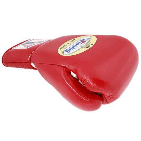 Official Winning professional lace-up training boxing gloves in premium red leather featuring white laces, a white contrast accent line, and the iconic brand logo crest on the cuffs.