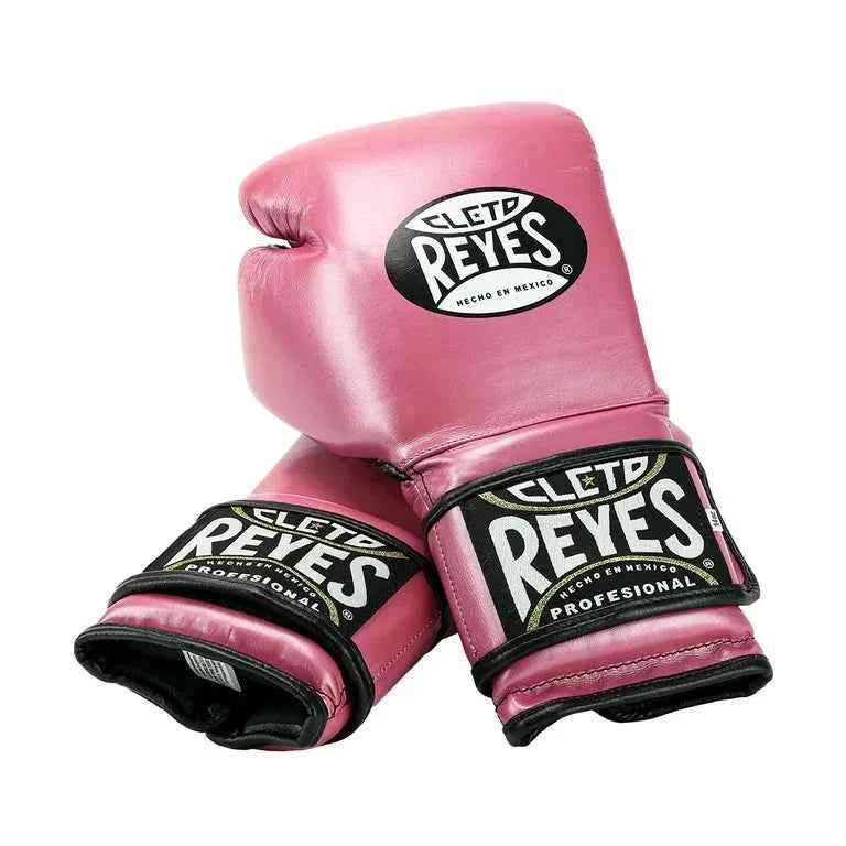 Official Cleto Reyes professional hook-and-loop training boxing gloves in pink metallic leather featuring a high-sheen magenta finish, black inner thumb lining, and traditional brand patches.