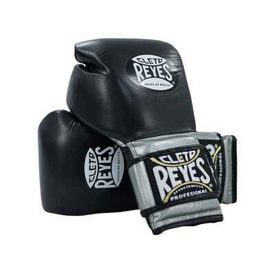 Official Cleto Reyes professional hook-and-loop training boxing gloves in black leather featuring brilliant metallic silver leather cuffs with the traditional black and gold brand patches.