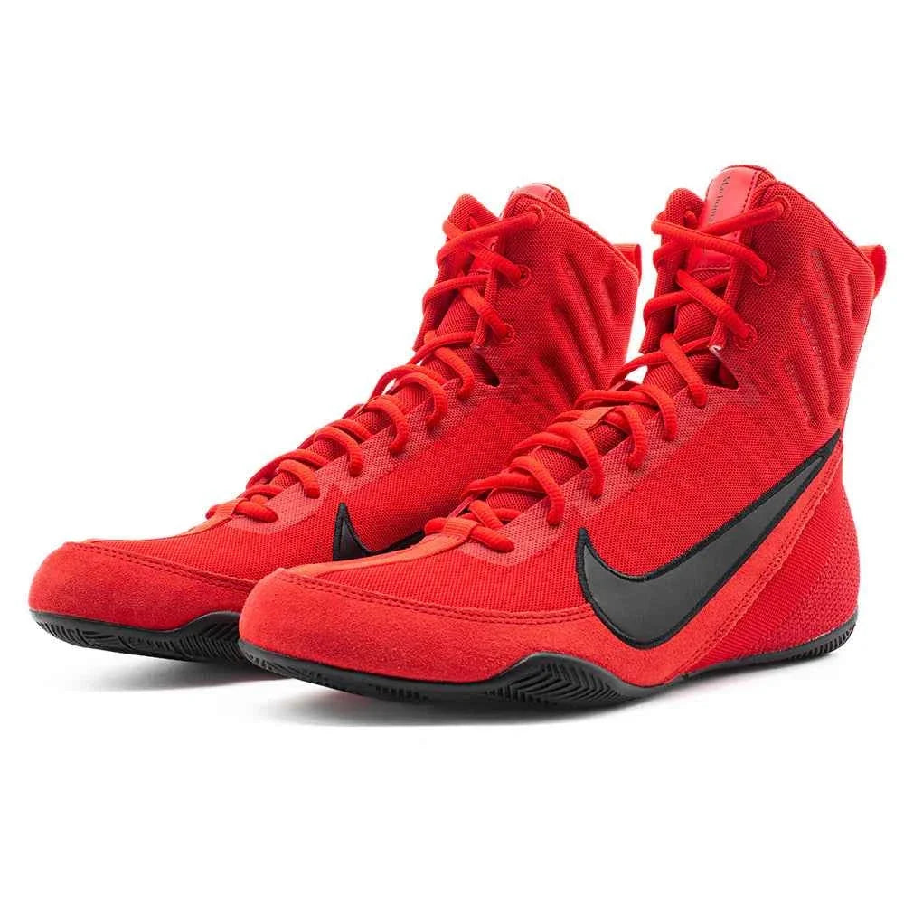 Pair of red high-top Nike Machomai 2 boxing shoes with black Swoosh logos on a white background