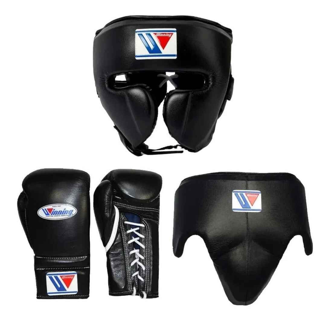 Official Winning professional 3-piece boxing sparring gear set in a matching classic black premium leather colorway, featuring lace-up training gloves, a face guard headgear, and a groin protector isolated against a clean white background.