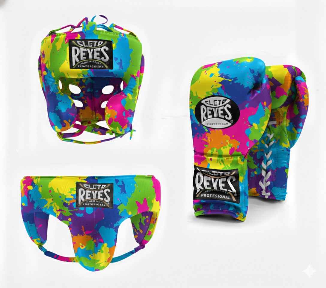 Official Cleto Reyes professional 3-piece boxing sparring gear set featuring matching lace-up gloves, a cheek protector headguard, and a groinguard in a uniform limited-edition multi-color paint splatter abstract leather design.