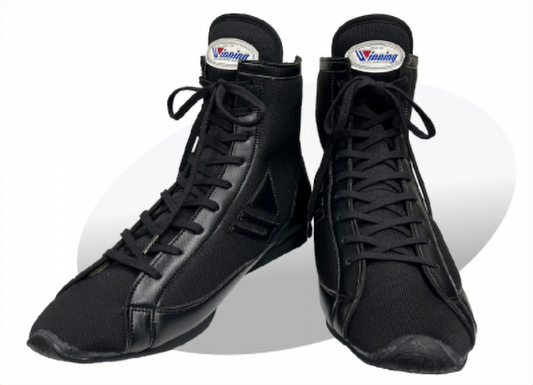 Pair of Winning RS-100 boxing shoes in sleek all-black colorway with high-top design and Winning logo on tongue