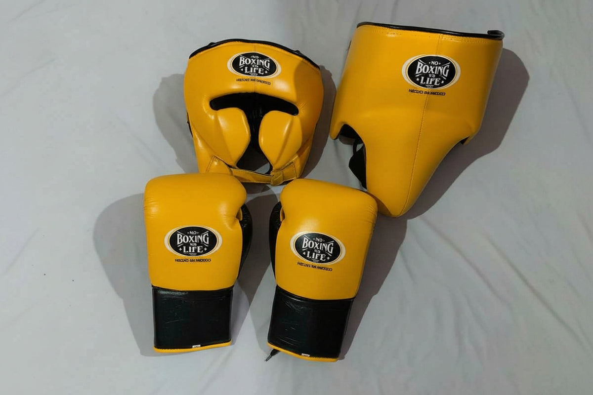 No Boxing No Life custom professional sparring set in yellow and black leather including lace-up gloves, headgear, and groin protector.